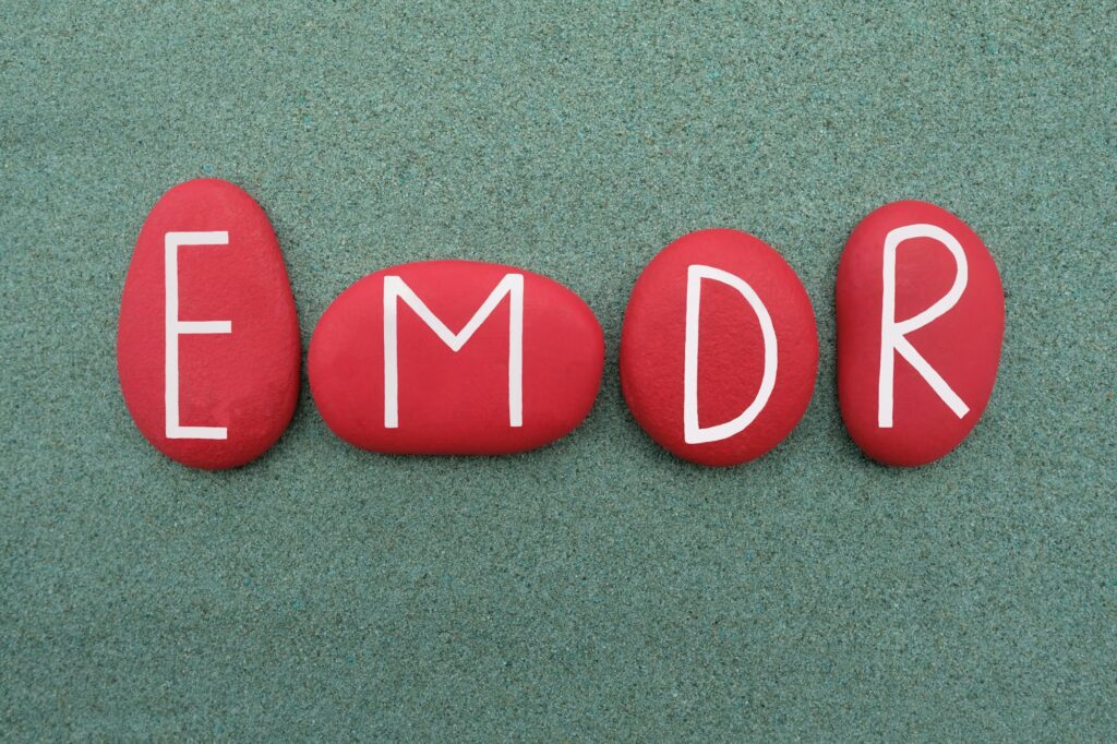 EMDR, Eye Movement Desensitization and Reprocessing, red stone letters logo