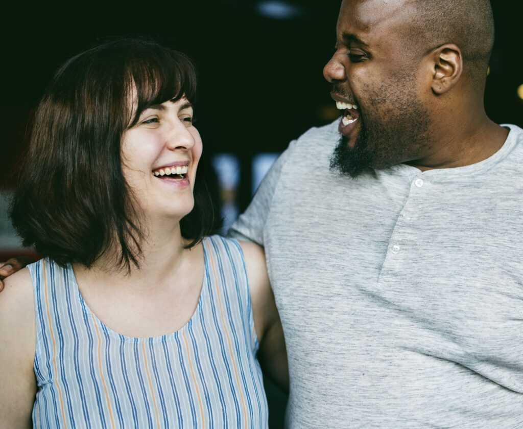 Happy couple laughing together