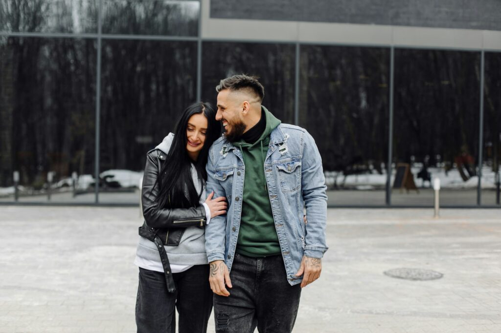 Outdoor happy couple in love posing near cafe