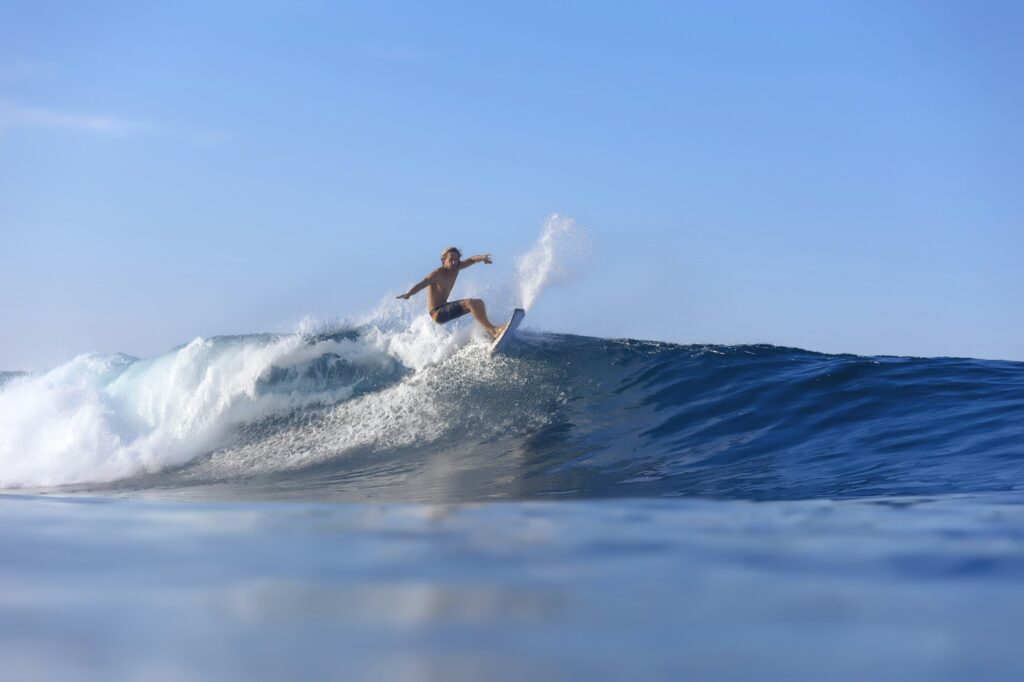 Indonesia, Sumatra, surfer on a wave